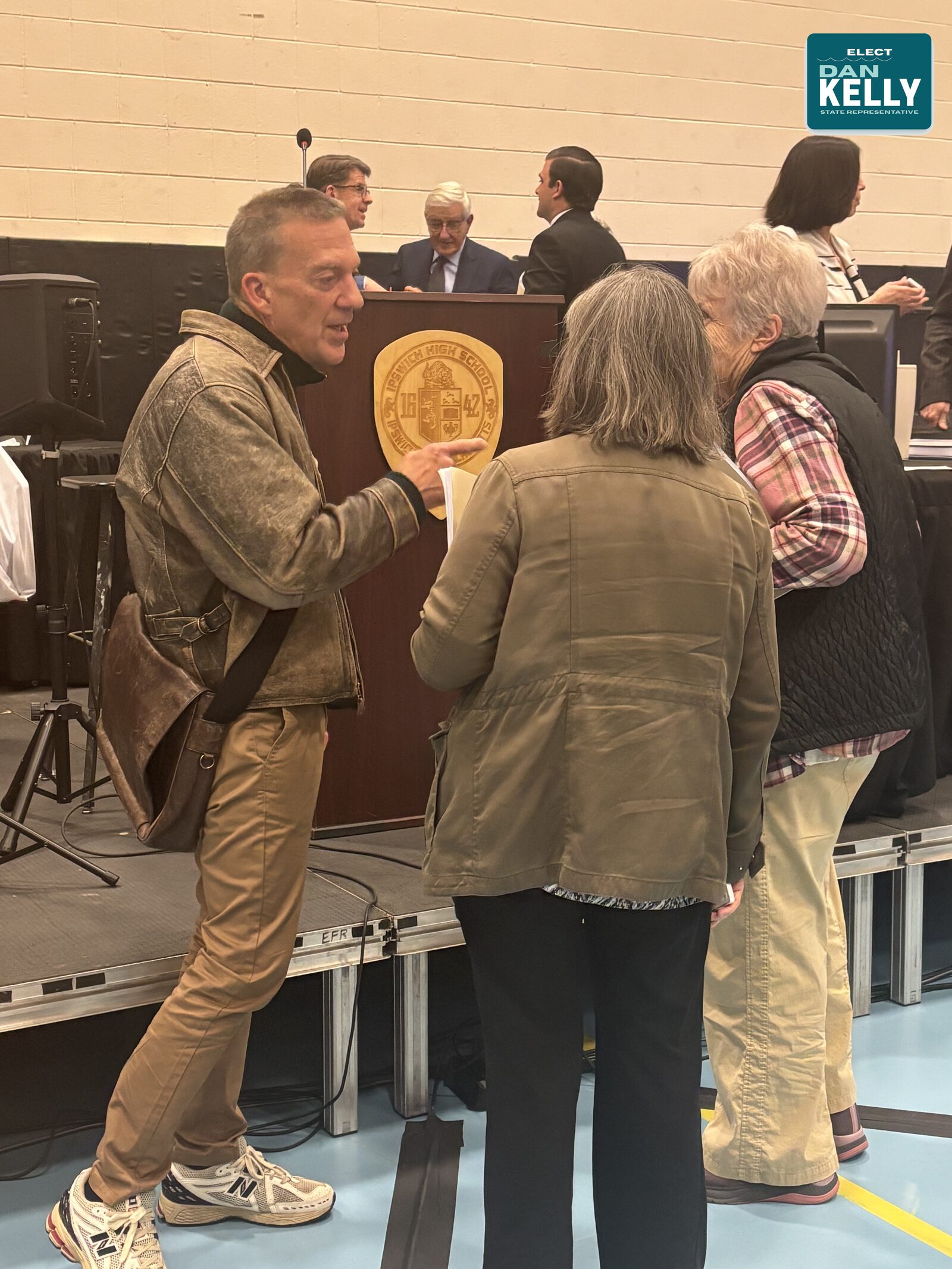 Dan Kelly engaging with constituents at a town podium.